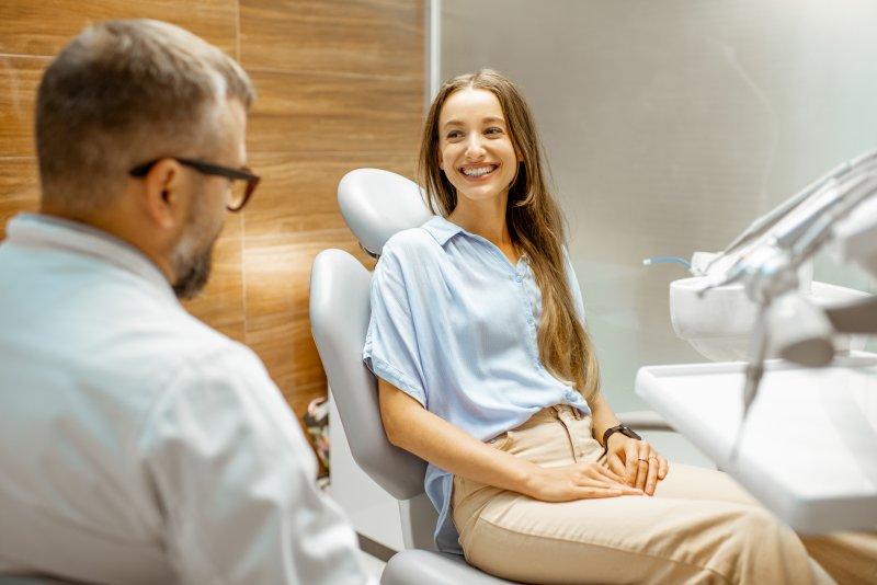 HCT Dental Clinic 2 Patient smiling at dentist during cosmetic dental consultation 3 October 2025 Vadodara India
