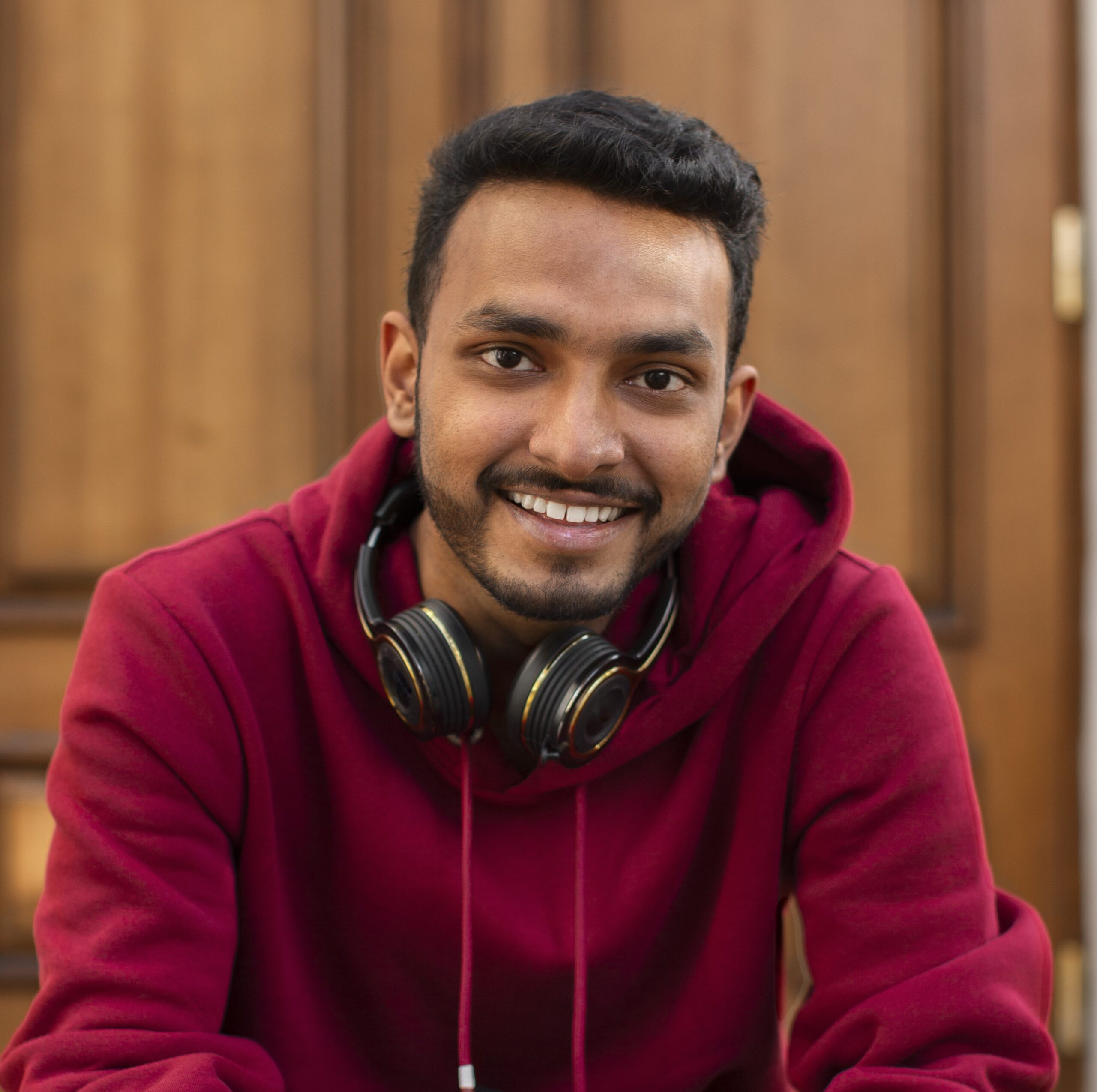 Esthetica Maxillofacial Hospital 39 smiley man with headphones front view 1 scaled October 2025 Vadodara India